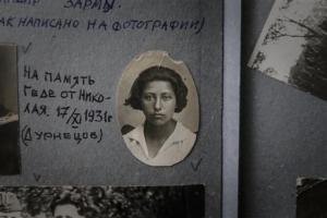 Geda Rozina, now 100, in a family photo album in Moscow (AP Photo/Sergey Ponomar